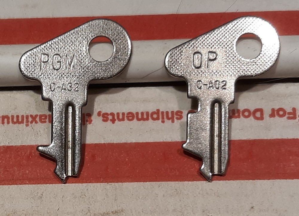 K80) 1 Lot of (2) PGM Casio Cash Register Keys #54; PGM #C-A32 & OP #C-A02.