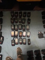 large lot of Janam barcode handheld scanners XP20W XM66W charging stations docks