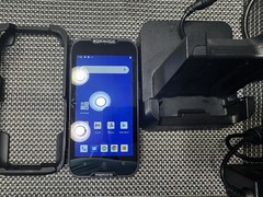 Datalogic MEMOR 10 with charger, docking cradle, protective case, and trigger.