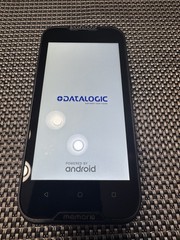 Datalogic MEMOR 10 with charger, docking cradle, protective case, and trigger.