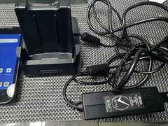 Datalogic MEMOR 10 with charger, docking cradle, protective case, and trigger.