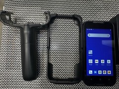 Datalogic MEMOR 10 with charger, docking cradle, protective case, and trigger.