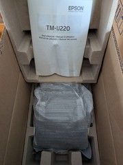 New Epson TMU950 and TMU220A receipt printers and box of TMU950 ribbons