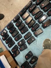 large lot of Janam barcode handheld scanners XP20W XM66W charging stations docks