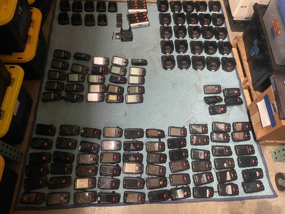 large lot of Janam barcode handheld scanners XP20W XM66W charging stations docks