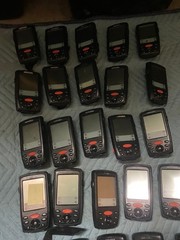 large lot of Janam barcode handheld scanners XP20W XM66W charging stations docks