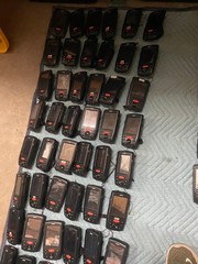 large lot of Janam barcode handheld scanners XP20W XM66W charging stations docks