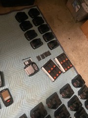 large lot of Janam barcode handheld scanners XP20W XM66W charging stations docks