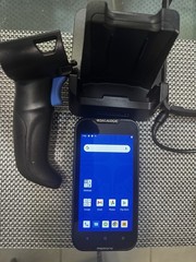 Datalogic MEMOR 10 with charger, docking cradle, protective case, and trigger.